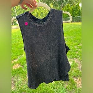 Basic black tank. Worn one time. Scoop hem